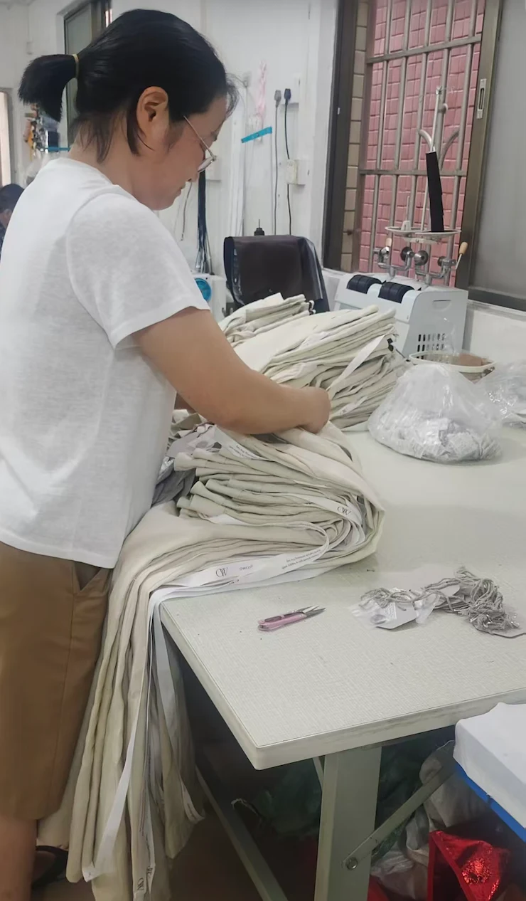 Final quality check and packing at the garment worktable